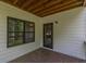 Well-lit back porch with an exterior door and large window, offering outdoor views at 1410 Eastland Rd Se Rd, Atlanta, GA 30316