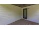 An empty covered balcony that is adjacent to the house features a glass door at 1410 Eastland Rd Se Rd, Atlanta, GA 30316