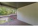 A covered balcony with grey railings has a partial view of the street and other houses at 1410 Eastland Rd Se Rd, Atlanta, GA 30316