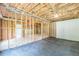 Unfinished basement with exposed framing, insulation, and concrete floor, offering customization options at 1410 Eastland Rd Se Rd, Atlanta, GA 30316
