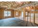 Unfinished basement featuring exposed framing, insulation, and a concrete floor with rubber matting at 1410 Eastland Rd Se Rd, Atlanta, GA 30316