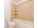 Bathroom featuring tile accents around the tub and toilet with neutral color palette at 1410 Eastland Rd Se Rd, Atlanta, GA 30316