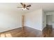 This bedroom features hardwood flooring, a ceiling fan, white trim and walls, and two points of entry at 1410 Eastland Rd Se Rd, Atlanta, GA 30316