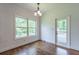 Bright bedroom with hardwood floors, large window, and direct access to outdoor deck at 1410 Eastland Rd Se Rd, Atlanta, GA 30316