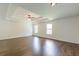 This spacious bedroom features hardwood floors and a tray ceiling with ceiling fan at 1410 Eastland Rd Se Rd, Atlanta, GA 30316