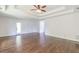 This spacious bedroom features hardwood floors and a tray ceiling with ceiling fan at 1410 Eastland Rd Se Rd, Atlanta, GA 30316