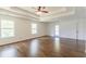 This spacious bedroom features hardwood floors and a tray ceiling with ceiling fan at 1410 Eastland Rd Se Rd, Atlanta, GA 30316