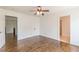 Bedroom with hardwood floors, ceiling fan, and doorways leading to other rooms at 1410 Eastland Rd Se Rd, Atlanta, GA 30316