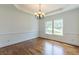 Dining room with hardwood floors, decorative lighting, chair rail molding, wainscoting and a large window at 1410 Eastland Rd Se Rd, Atlanta, GA 30316