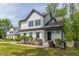 Charming two-story home featuring a white exterior with black trim and a well-manicured lawn at 1410 Eastland Rd Se Rd, Atlanta, GA 30316