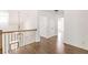This hallway boasts gleaming hardwood floors and an elegant wrought iron railing at 1410 Eastland Rd Se Rd, Atlanta, GA 30316