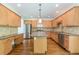 Spacious kitchen with wooden cabinets, granite countertops, stainless steel appliances, and center island at 1410 Eastland Rd Se Rd, Atlanta, GA 30316