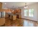 Open-concept kitchen featuring granite counters, stainless appliances, tile backsplash and hardwood floors at 1410 Eastland Rd Se Rd, Atlanta, GA 30316