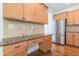 Kitchen includes granite countertops, wood cabinets, stainless appliances, and hardwood floors at 1410 Eastland Rd Se Rd, Atlanta, GA 30316