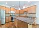 Kitchen featuring wood cabinets, granite countertops, stainless appliances, and a center island at 1410 Eastland Rd Se Rd, Atlanta, GA 30316