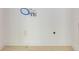 Unfinished laundry room with tile floors, water hook-up, electrical outlet, and white walls at 1410 Eastland Rd Se Rd, Atlanta, GA 30316