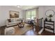 Comfortable living room with hardwood floors and a large window, perfect for relaxation at 1410 Eastland Rd Se Rd, Atlanta, GA 30316