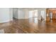 Open-concept living room with hardwood floors, recessed lighting and seamless transitions to the kitchen and dining areas at 1410 Eastland Rd Se Rd, Atlanta, GA 30316