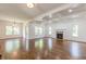 Open living space featuring hardwood floors, coffered ceilings, recessed lights and seamless transitions to the dining room and kitchen at 1410 Eastland Rd Se Rd, Atlanta, GA 30316
