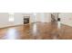 Living room with hardwood floors, large windows, a fireplace and easy access to the staircase and front entryway at 1410 Eastland Rd Se Rd, Atlanta, GA 30316