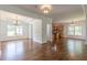 Living room featuring hardwood floors with an open layout flowing into the dining room and kitchen, filled with natural light at 1410 Eastland Rd Se Rd, Atlanta, GA 30316