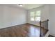 Cozy loft area featuring hardwood floors and a large window with backyard views at 1410 Eastland Rd Se Rd, Atlanta, GA 30316