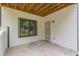 A covered patio with a metal door and a window with metal bars at 1410 Eastland Rd Se Rd, Atlanta, GA 30316