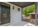 Covered porch with a security door and a dark ceiling at 1410 Eastland Rd Se Rd, Atlanta, GA 30316