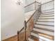 Staircase with hardwood steps and wrought iron railing at 1410 Eastland Rd Se Rd, Atlanta, GA 30316