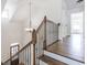 Staircase with hardwood steps and wrought iron railing with landing view at 1410 Eastland Rd Se Rd, Atlanta, GA 30316