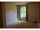 Empty bedroom with window and blue curtains at 3272 Baylor Cir, Mcdonough, GA 30253
