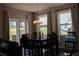 Bright dining area with chandelier and backyard views at 3272 Baylor Cir, Mcdonough, GA 30253