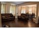Spacious living room with dark wood floors and dining area at 3272 Baylor Cir, Mcdonough, GA 30253