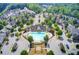 An aerial view of a community pool and clubhouse surrounded by lush landscaping and residences at 550 Constellation Overlook Sw, Atlanta, GA 30331