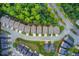 Overhead shot displays harmonious home rooftops and tree-lined streets, forming a symmetrical neighborhood layout with serene green spaces at 550 Constellation Overlook Sw, Atlanta, GA 30331