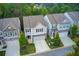 Aerial view showcasing a well-planned community with manicured lawns and tree-lined streets on a sunny day at 550 Constellation Overlook Sw, Atlanta, GA 30331