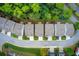 Aerial view capturing symmetrical home rooftops, landscaped yards along a curved street, embraced by lush green trees and vegetation at 550 Constellation Overlook Sw, Atlanta, GA 30331