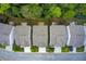 Aerial perspective showing home rooftops, well-manicured lawns, driveways and verdant greenery lining the street for enhanced curb appeal at 550 Constellation Overlook Sw, Atlanta, GA 30331