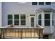 A wooden back deck with gray siding, large windows and a door leading outside at 550 Constellation Overlook Sw, Atlanta, GA 30331