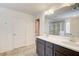 Bathroom featuring a double sink vanity with dark cabinets and a walk-in shower at 550 Constellation Overlook Sw, Atlanta, GA 30331