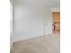 A simple bedroom with white walls and a window near a door at 550 Constellation Overlook Sw, Atlanta, GA 30331
