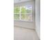 Carpeted bedroom with large window allowing natural light to fill the room at 550 Constellation Overlook Sw, Atlanta, GA 30331