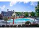Relaxing community pool with lounge chairs and umbrellas in a well-maintained neighborhood at 550 Constellation Overlook Sw, Atlanta, GA 30331