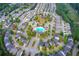 Overhead view showcases community amenities: pool, clubhouse, playground surrounded by lush trees in a welcoming residential neighborhood at 550 Constellation Overlook Sw, Atlanta, GA 30331