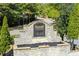 The Cascades neighborhood entrance features a stone sign and a beautifully landscaped entry at 550 Constellation Overlook Sw, Atlanta, GA 30331