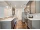 Modern kitchen boasts stainless steel appliances, gray cabinetry, and sleek countertops at 550 Constellation Overlook Sw, Atlanta, GA 30331