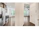 Open kitchen boasts stainless steel appliances and dark wood floors with an adjacent view to a naturally lit living area at 550 Constellation Overlook Sw, Atlanta, GA 30331