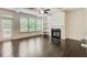 Cozy living room featuring a fireplace, built-in shelves and sliding doors to the deck at 550 Constellation Overlook Sw, Atlanta, GA 30331