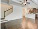Open concept living space featuring hardwood floors, access to kitchen and stairs at 550 Constellation Overlook Sw, Atlanta, GA 30331