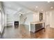 Open concept living room and kitchen with fireplace, hardwood floors, and modern finishes at 550 Constellation Overlook Sw, Atlanta, GA 30331